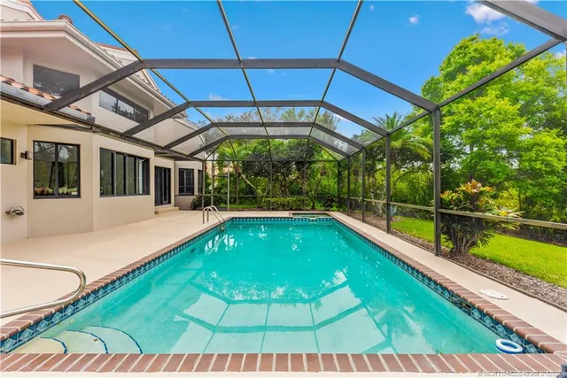 a swimming pool with a garden view