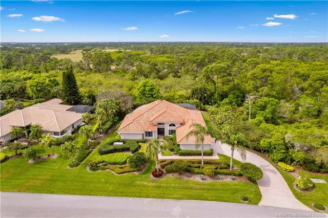 a view of a pool in front of the house