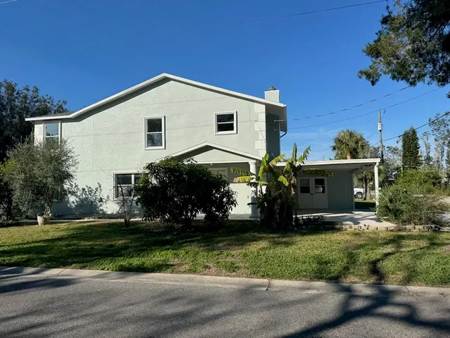 a view of house with yard