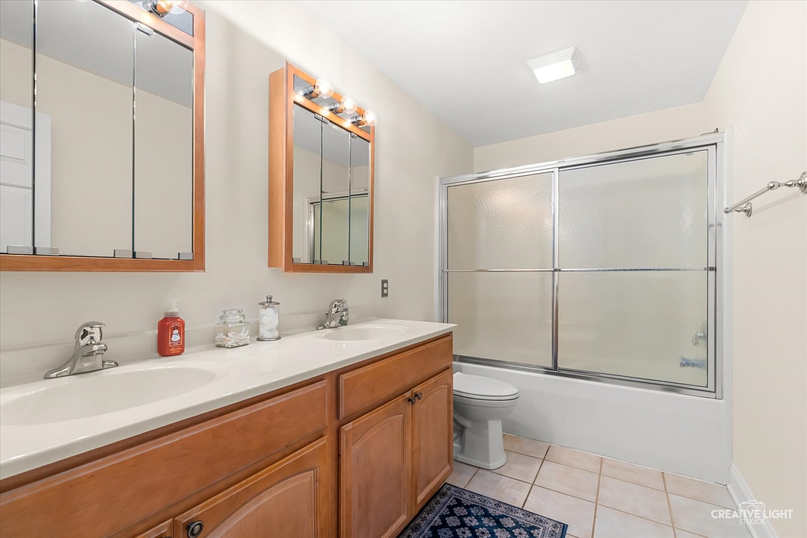 3160 Covered Bridge Lane DeKalb, IL 60115 - Photo 14 of 28 a bathroom with a sink a toilet and shower