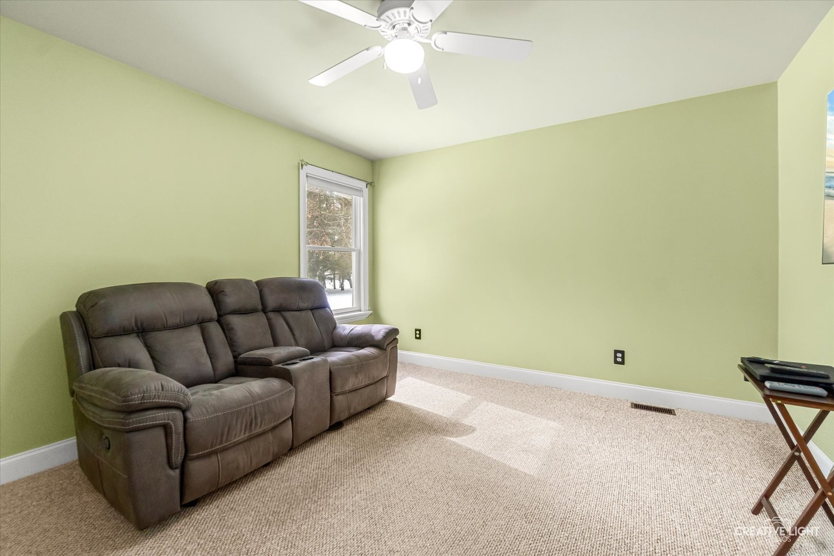 3160 Covered Bridge Lane DeKalb, IL 60115 - Photo 16 of 28 a living room with a couch and a ceiling fan
