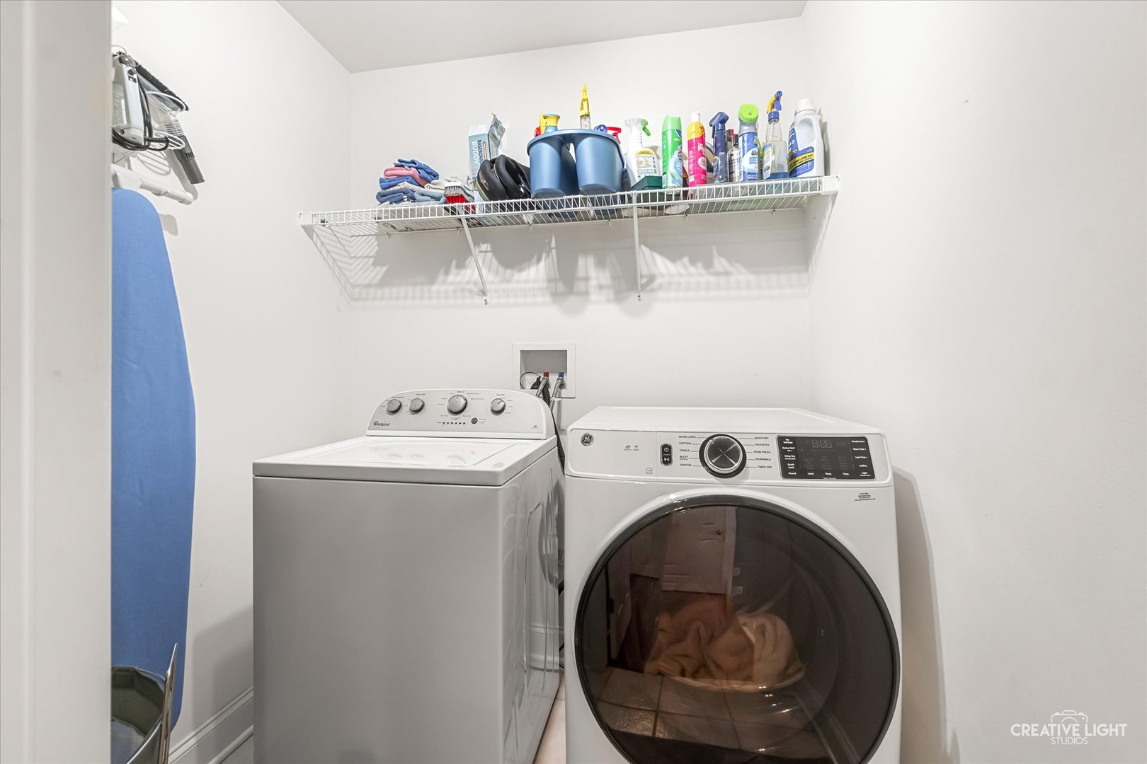 3160 Covered Bridge Lane DeKalb, IL 60115 - Photo 17 of 28 a view of washer and dryer with kitchen in the background