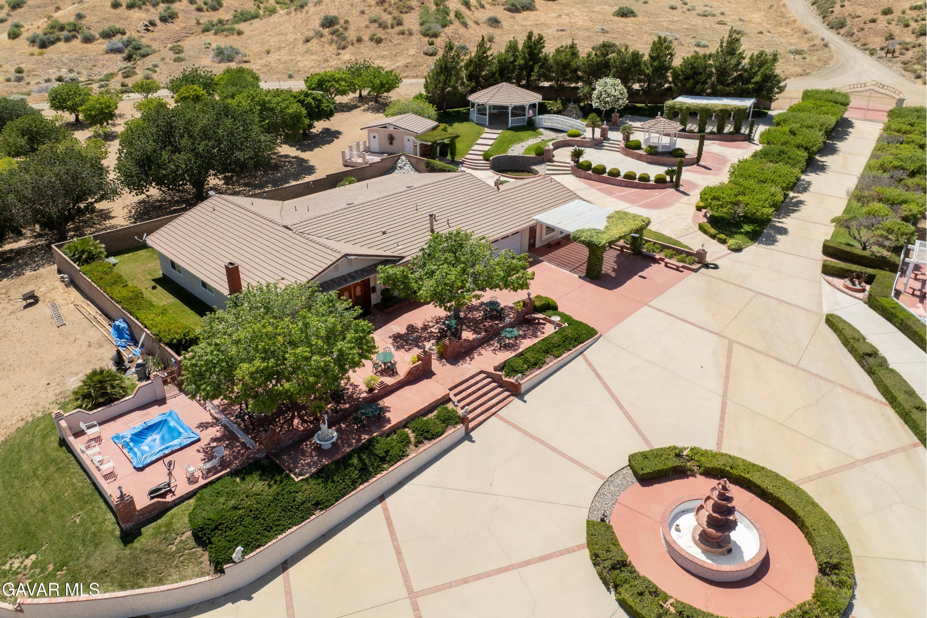 5801 Hacienda Ranch Road Palmdale, CA 93551 - Photo 2 of 69 an aerial view of a house with garden space and ocean view