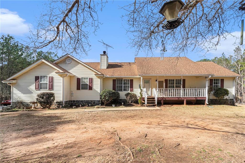 2757 Peeksville Road Locust Grove, GA 30248 - Photo 1 of 1 a front view of a house with a yard
