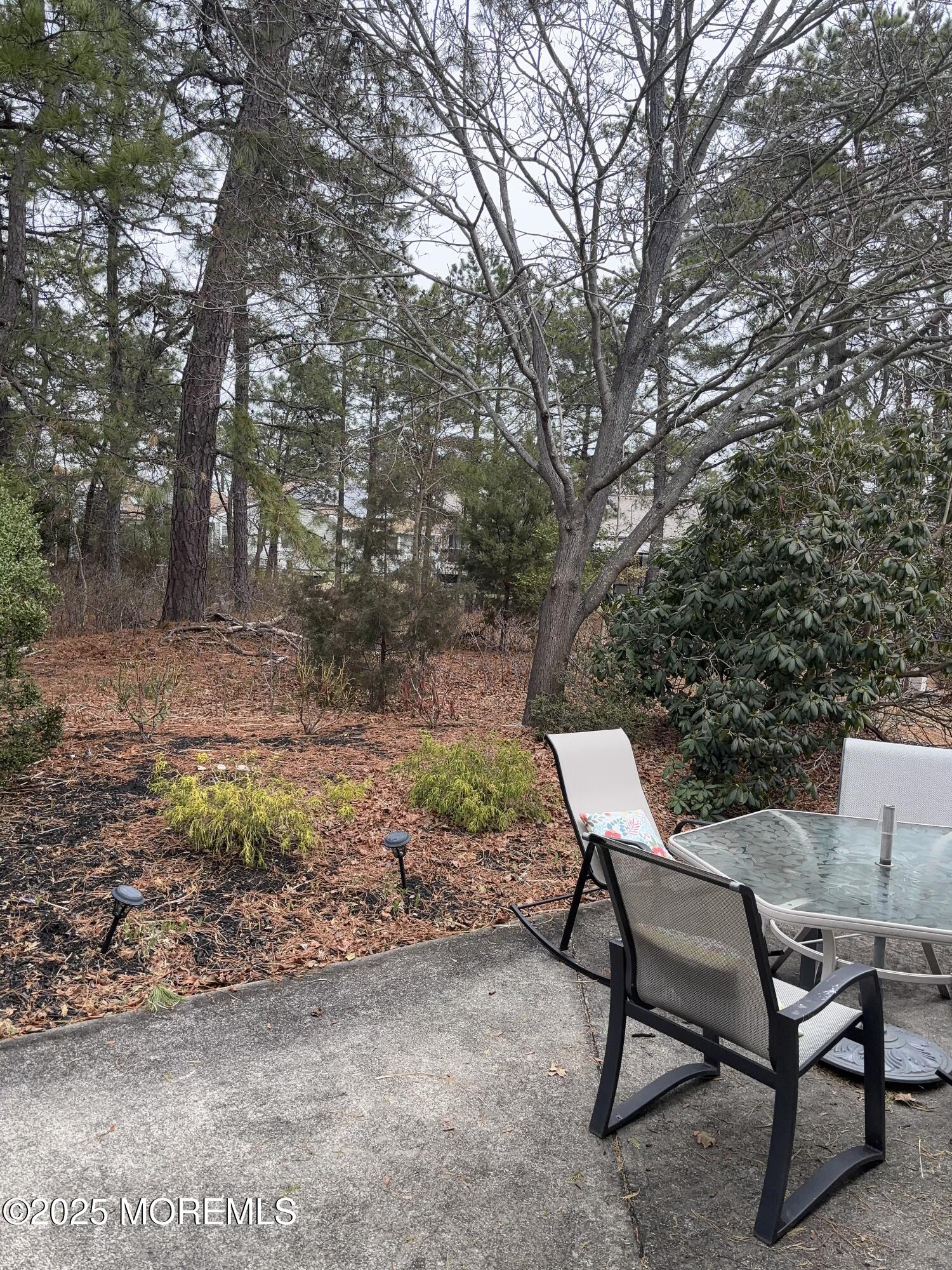 12 Dawn Way Toms River, NJ 08757 - Photo 16 of 19 a backyard of a house with table and chairs