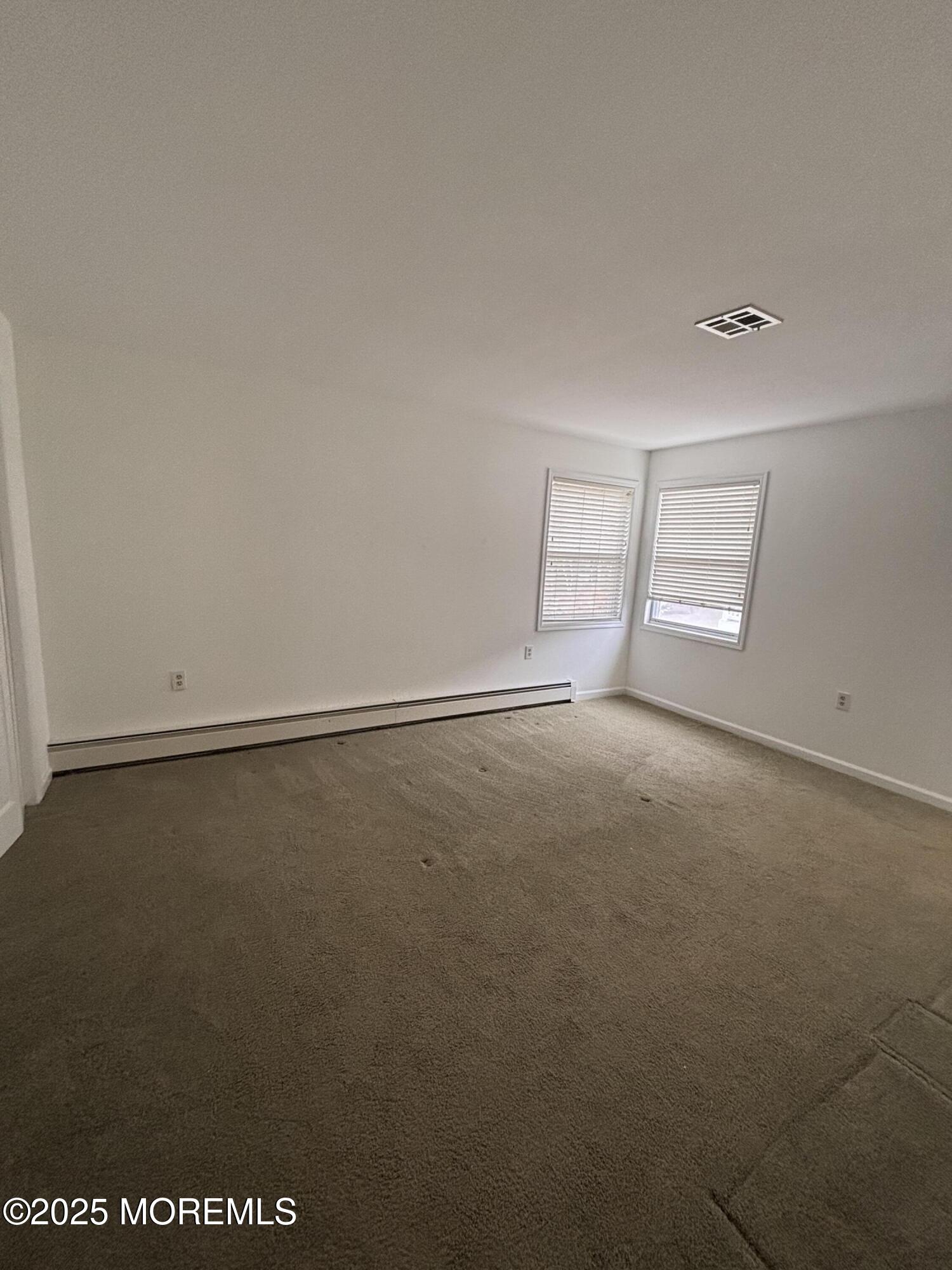 12 Dawn Way Toms River, NJ 08757 - Photo 8 of 19 an empty room with a empty space and window