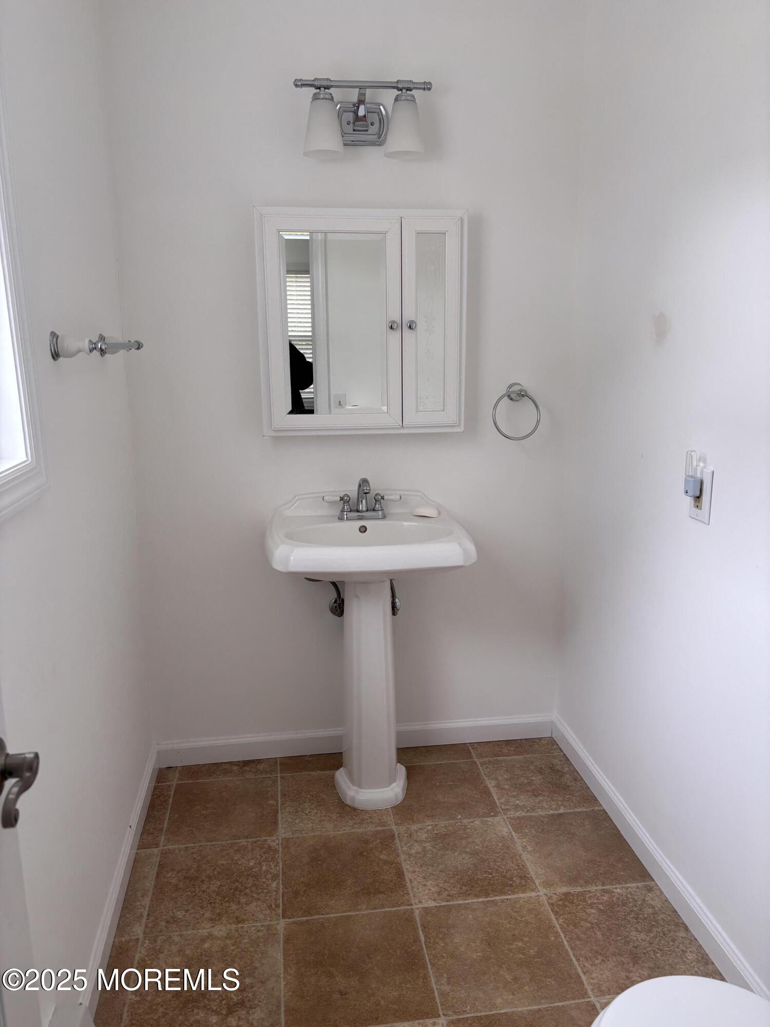 12 Dawn Way Toms River, NJ 08757 - Photo 9 of 19 a bathroom with a sink a mirror and vanity
