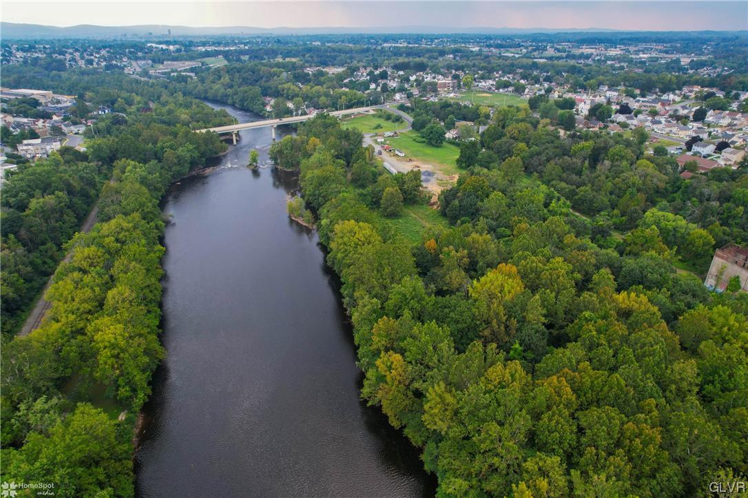 3161 East Church Street Coplay, PA 18037 - Photo 5 of 17 a view of a city with lush green forest