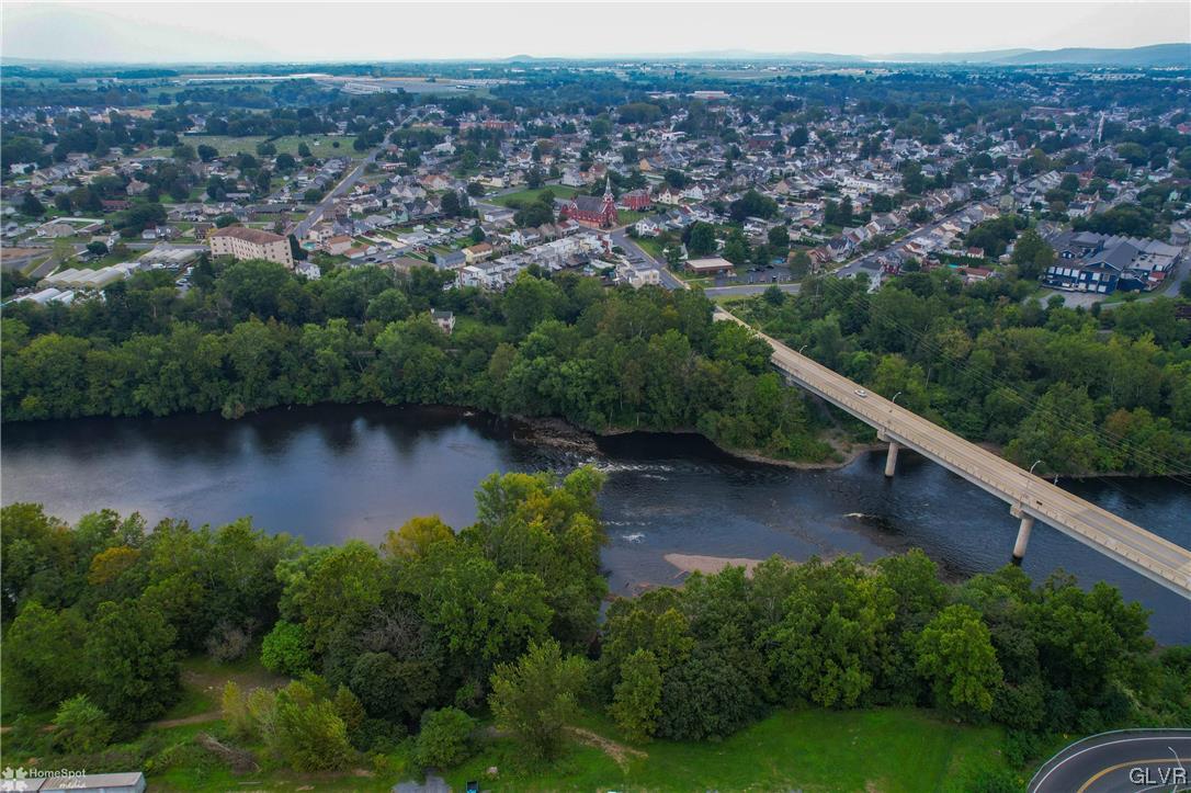 3161 East Church Street Coplay, PA 18037 - Photo 8 of 17 an aerial view of residential house with outdoor space and lake view