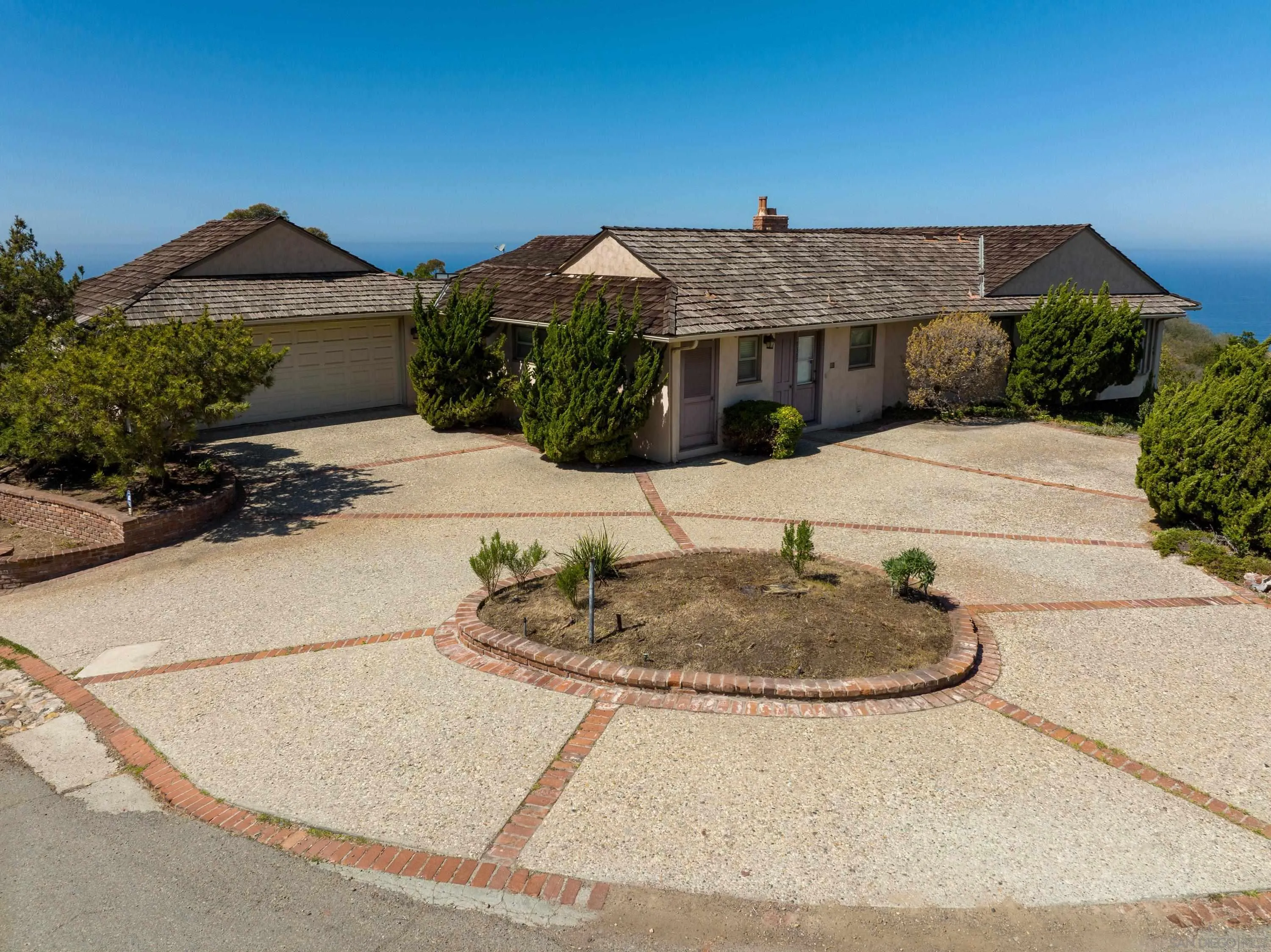 7362 Brodiaea Way La Jolla, CA 92037 - Photo 2 of 32 a view of a house with a fountain and a pathway