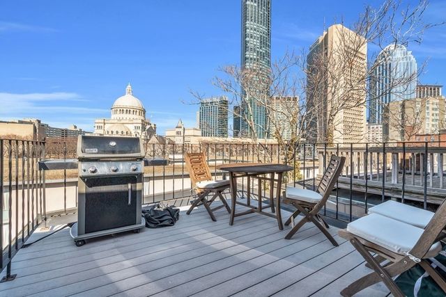 a view of a balcony with chairs