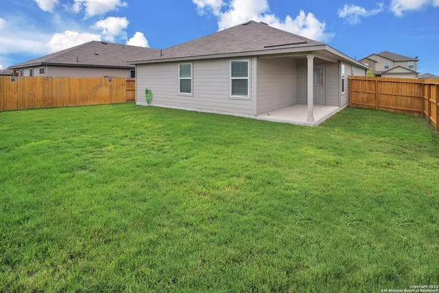 a front view of a house with yard