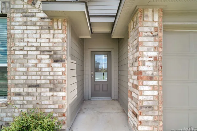 a bathroom with a shower and a sink