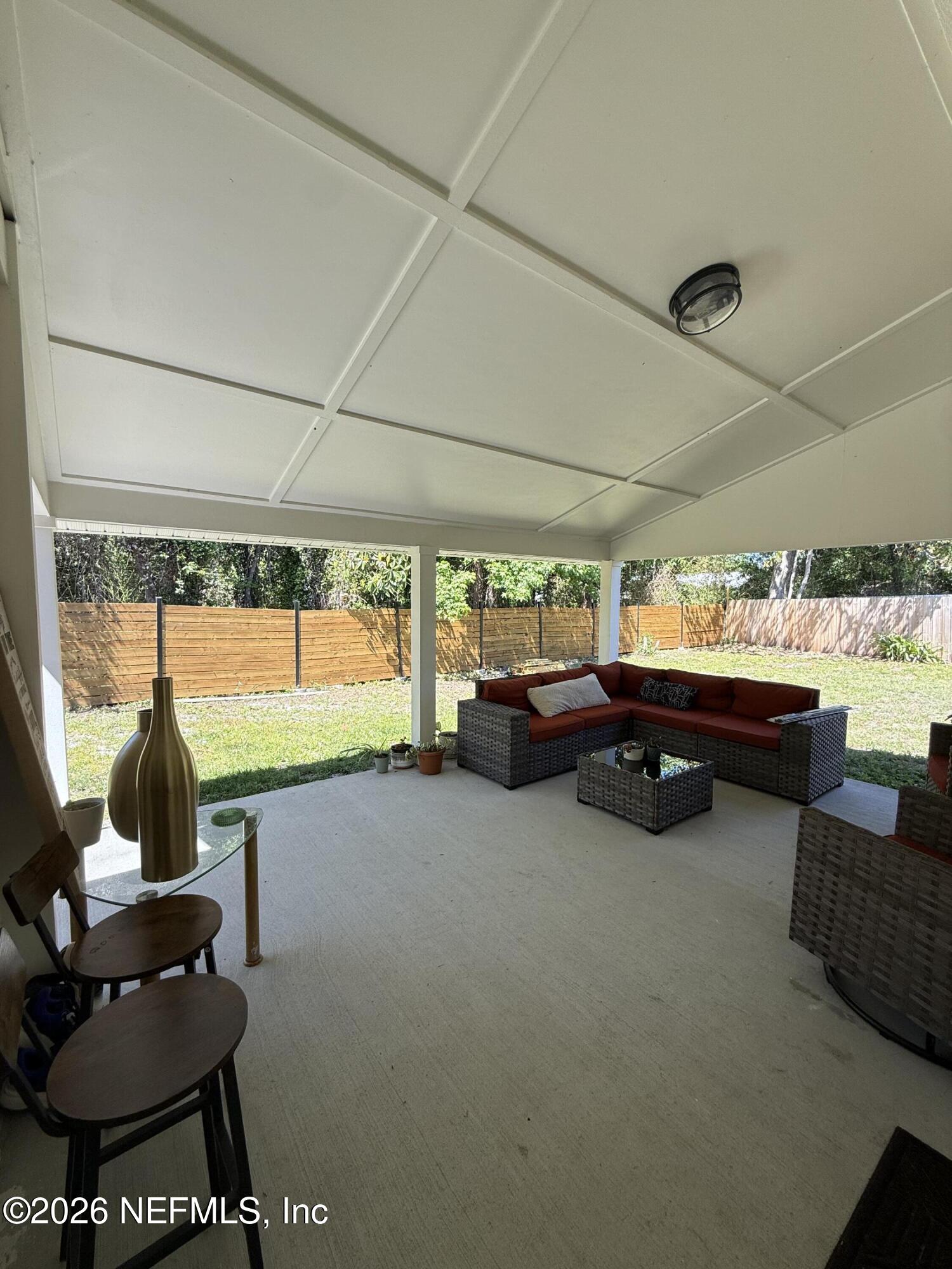8618 Boxberry Lane Jacksonville, FL 32244 - Photo 12 of 18 a room with car parked furniture