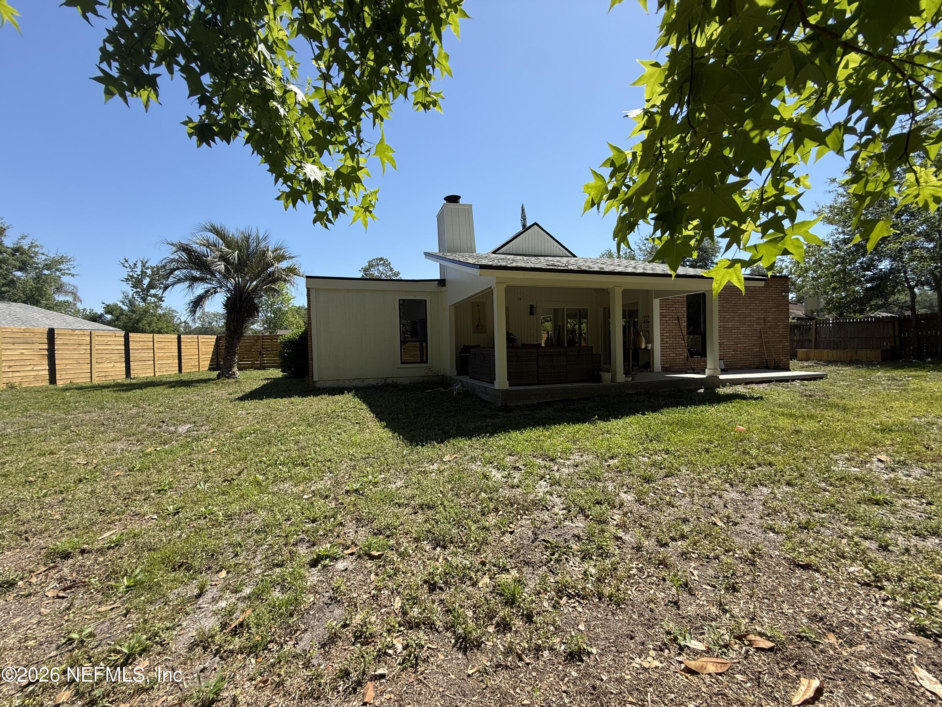 8618 Boxberry Lane Jacksonville, FL 32244 - Photo 14 of 18 a front view of a house with a garden