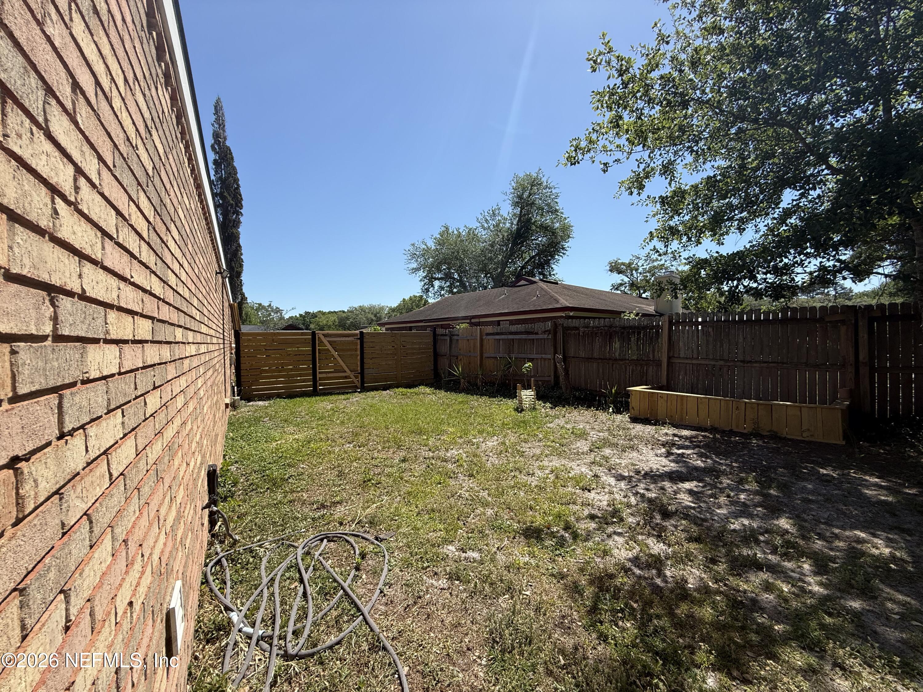 8618 Boxberry Lane Jacksonville, FL 32244 - Photo 17 of 18 a view of a backyard