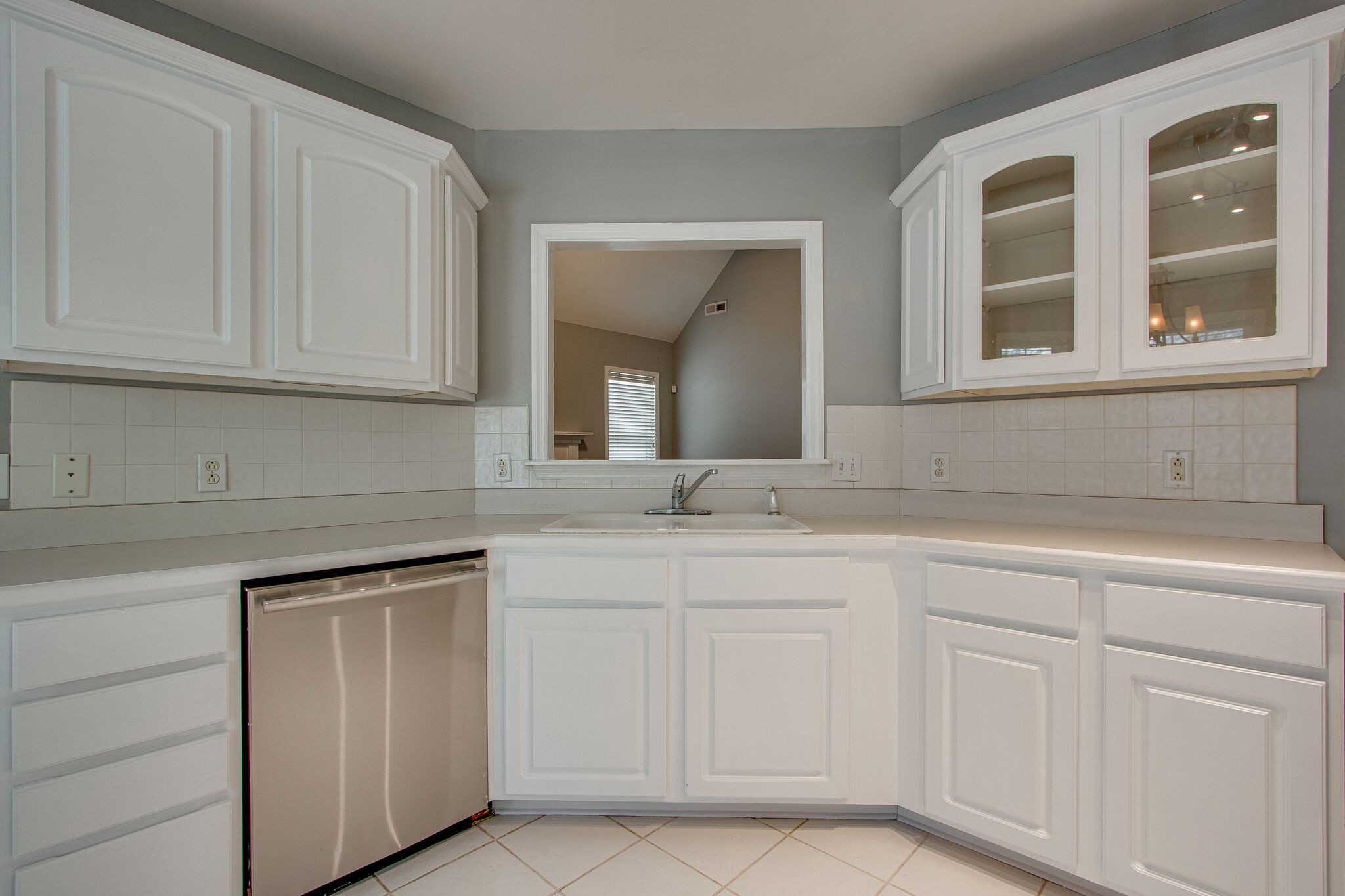 1615 Pacer Court Spring Hill, TN 37174 - Photo 11 of 30 a kitchen with white cabinets and a sink