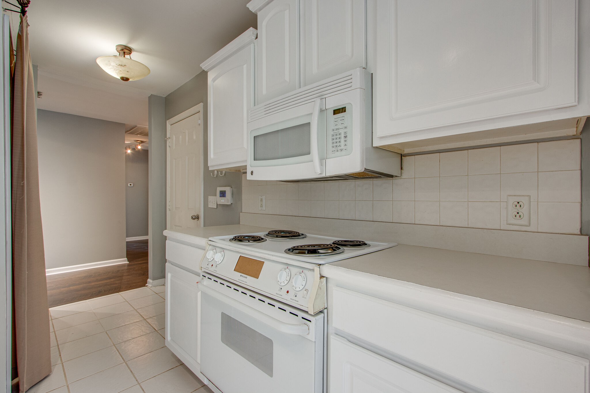 1615 Pacer Court Spring Hill, TN 37174 - Photo 12 of 30 a white stove top oven sitting inside of a kitchen