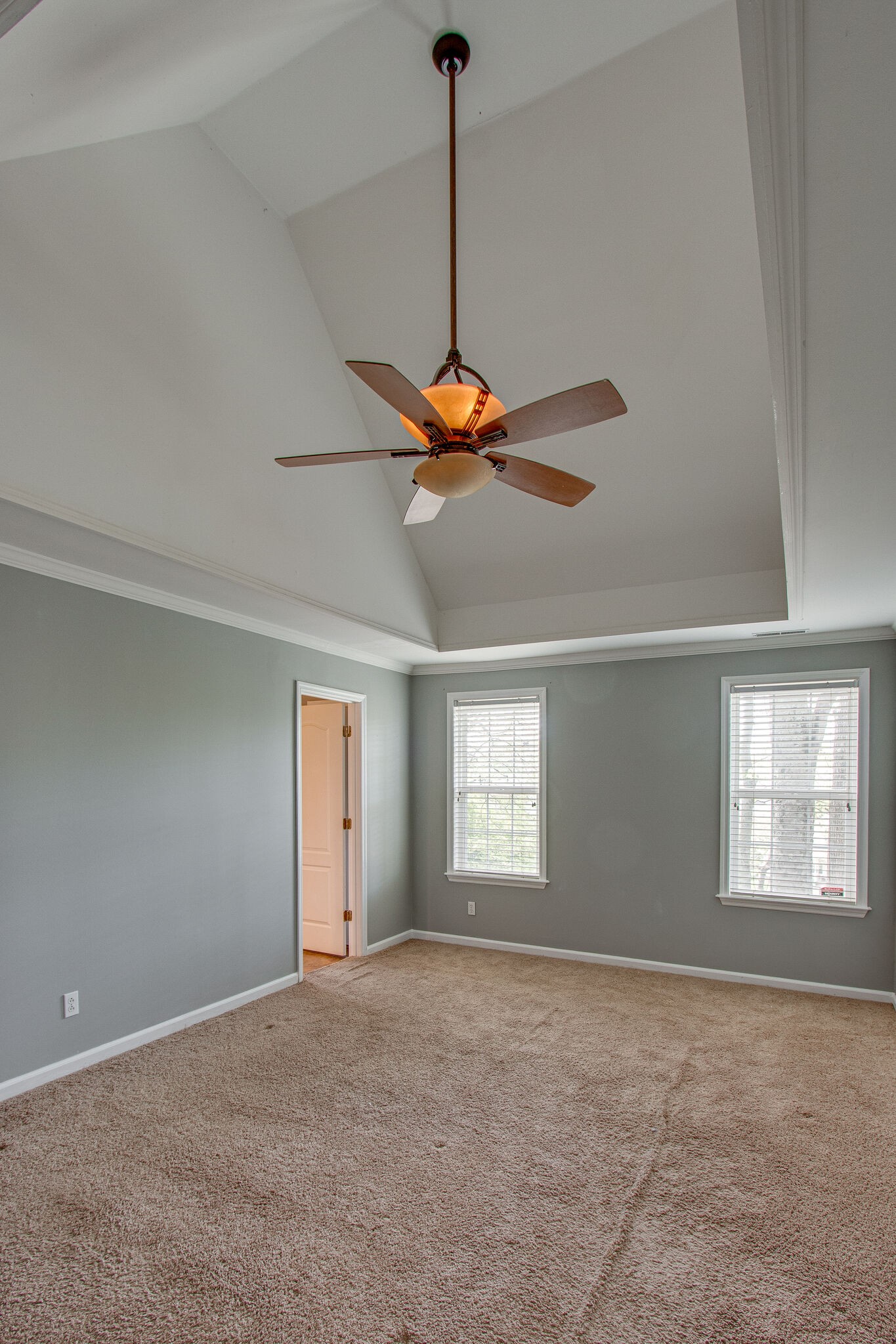 1615 Pacer Court Spring Hill, TN 37174 - Photo 17 of 30 a view of a livingroom with a chandelier fan and windows