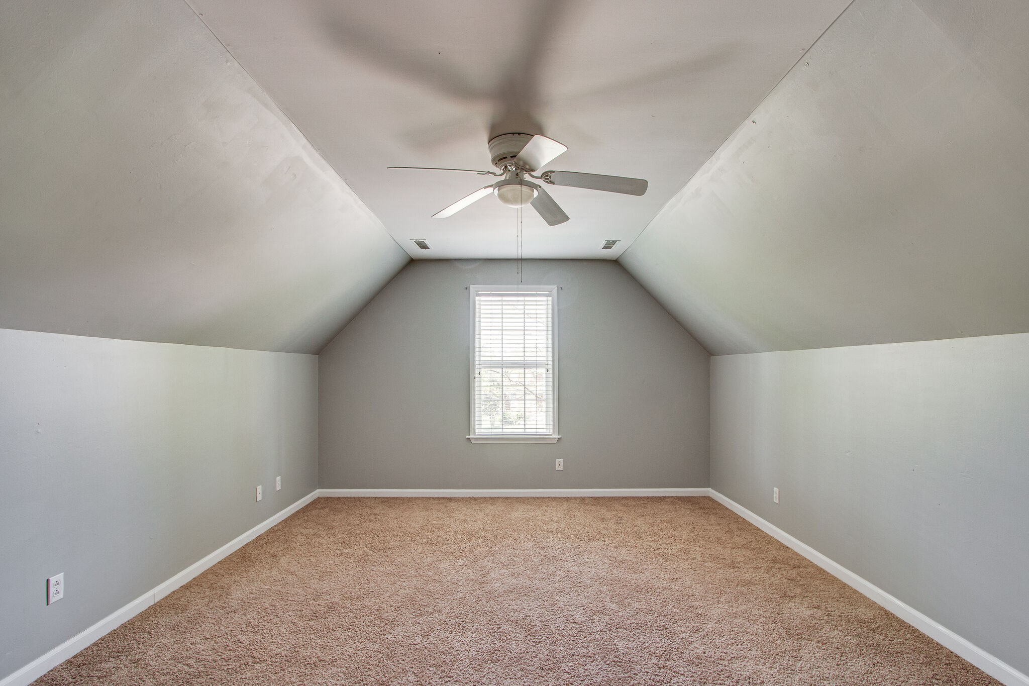 1615 Pacer Court Spring Hill, TN 37174 - Photo 27 of 30 an empty room with windows and ceiling fan