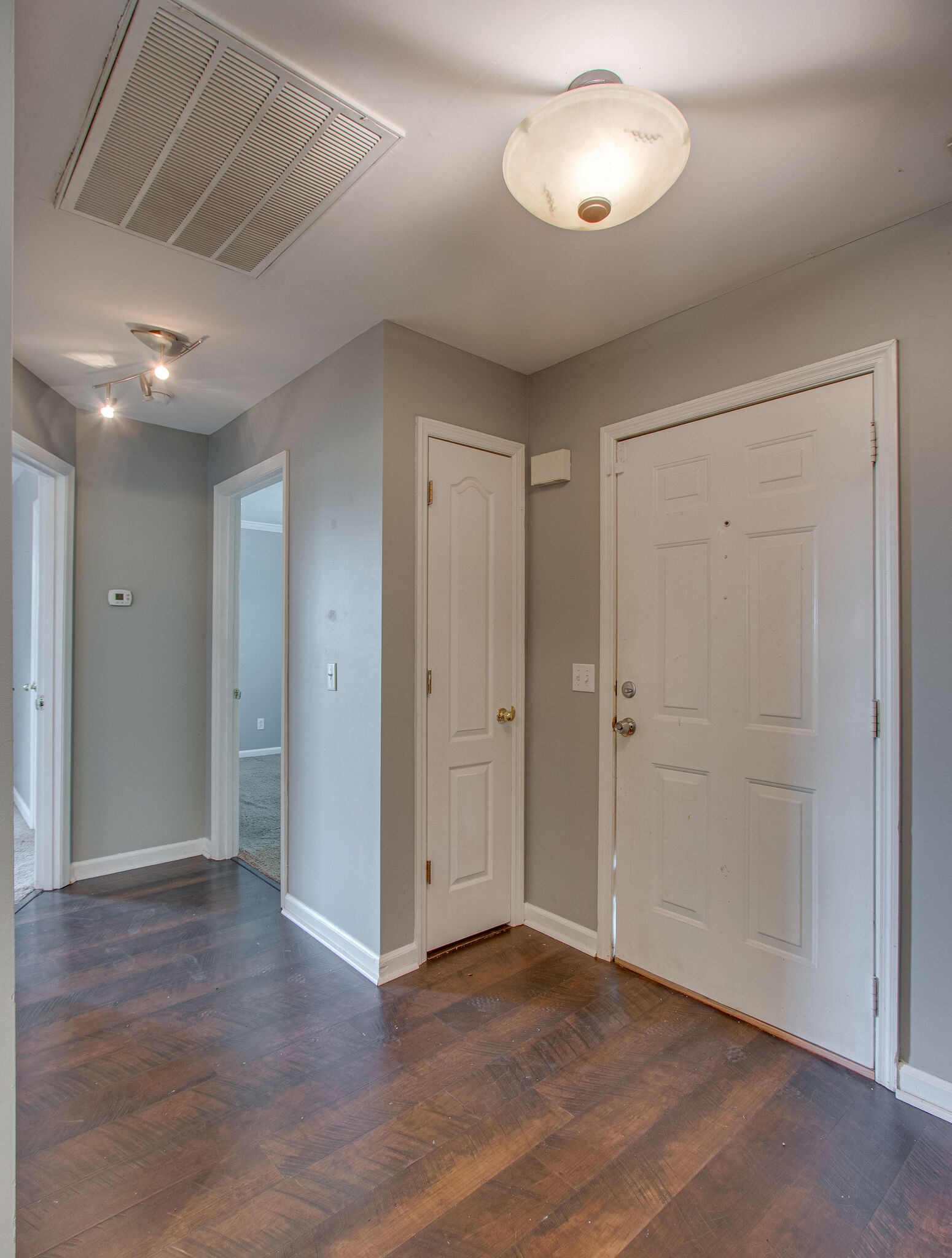 1615 Pacer Court Spring Hill, TN 37174 - Photo 4 of 30 an empty room with wooden floor and a ceiling fan