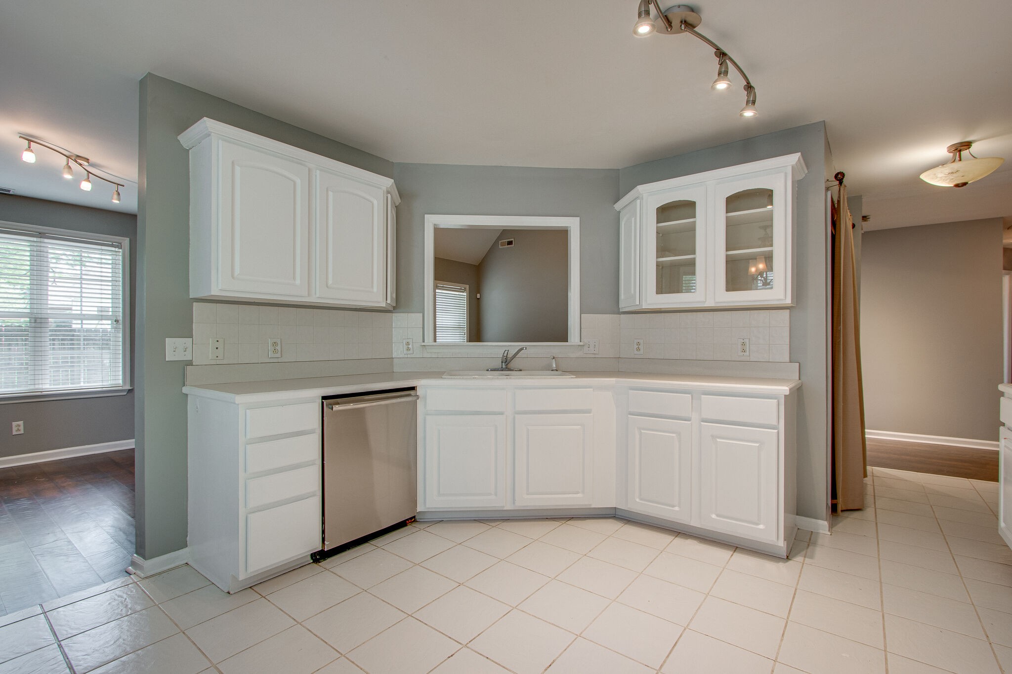 1615 Pacer Court Spring Hill, TN 37174 - Photo 10 of 30 a kitchen with granite countertop white cabinets and white appliances