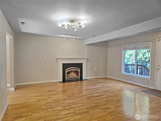 a kitchen with granite countertop a sink stove and cabinets