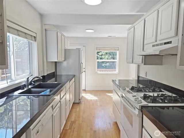 a balcony with wooden floor and fence
