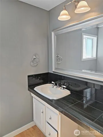 a view of an empty room with glass door and balcony