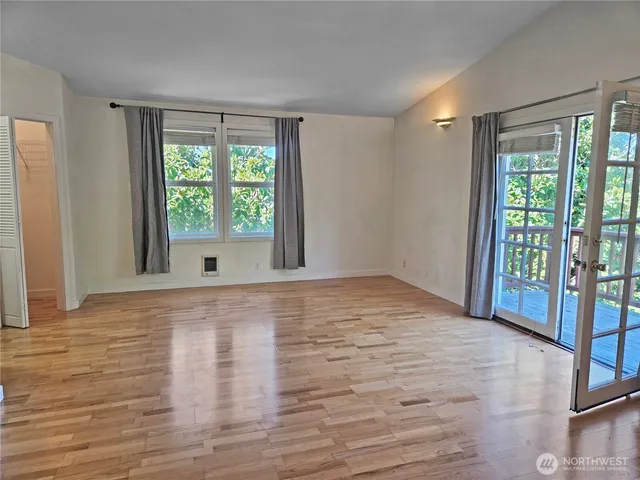 a view of kitchen with sink and refrigerator