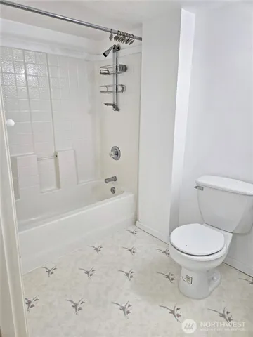 an entryway with a window and a livingroom