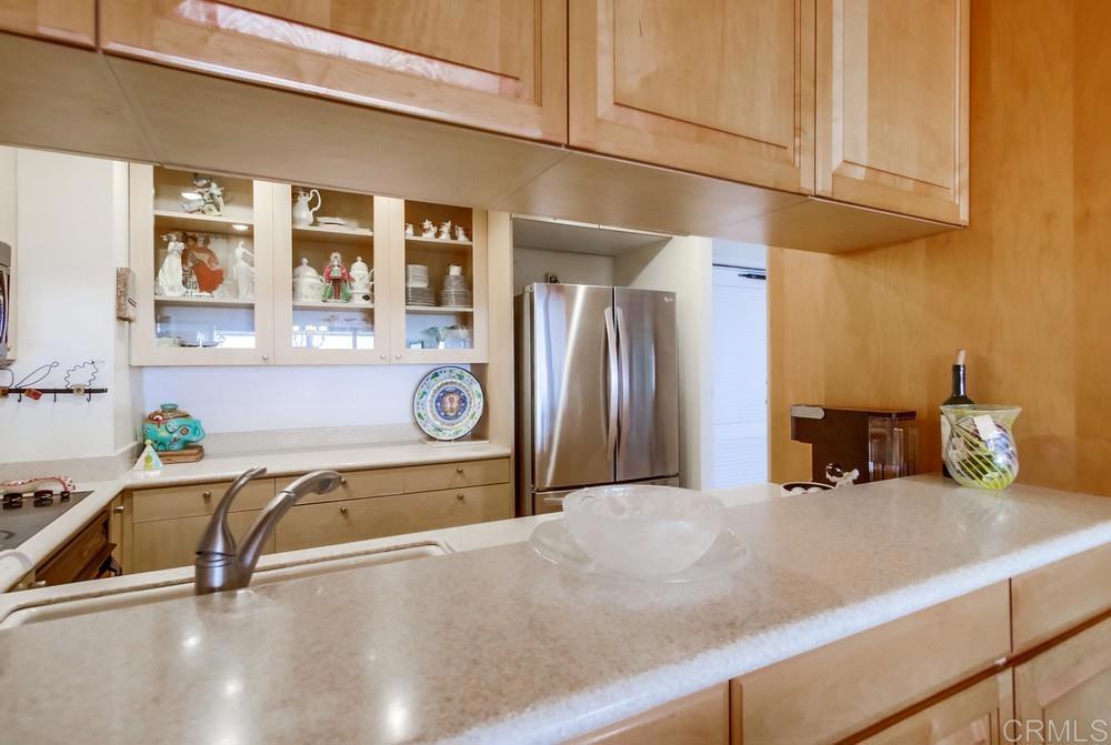 2500 Torrey Pines Road, Unit 802 La Jolla, CA 92037 - Photo 13 of 40 a kitchen with a refrigerator and a sink
