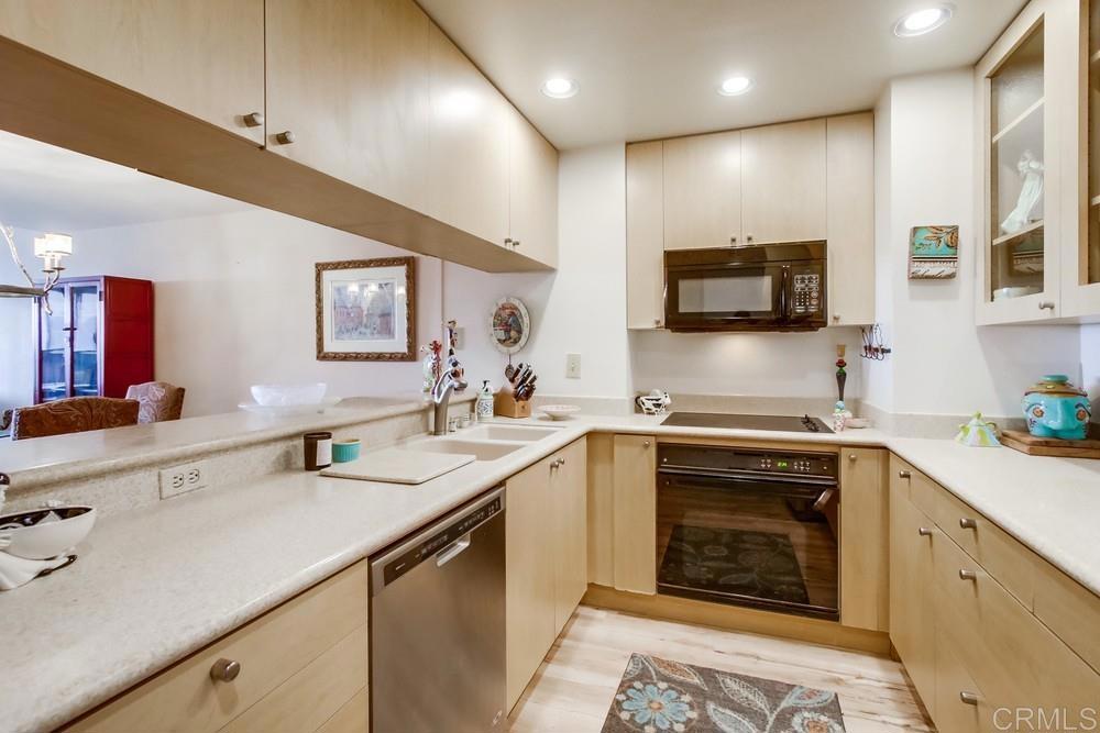 2500 Torrey Pines Road, Unit 802 La Jolla, CA 92037 - Photo 14 of 40 a kitchen with a sink stove and microwave