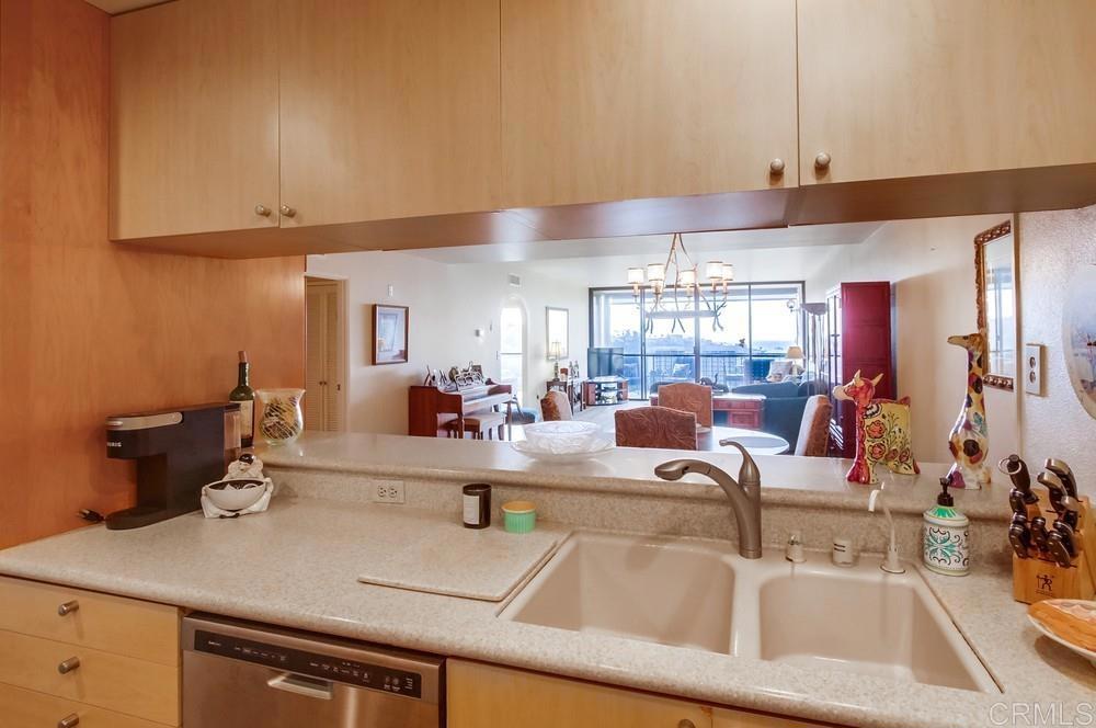 2500 Torrey Pines Road, Unit 802 La Jolla, CA 92037 - Photo 15 of 40 a kitchen with a sink and a cabinets