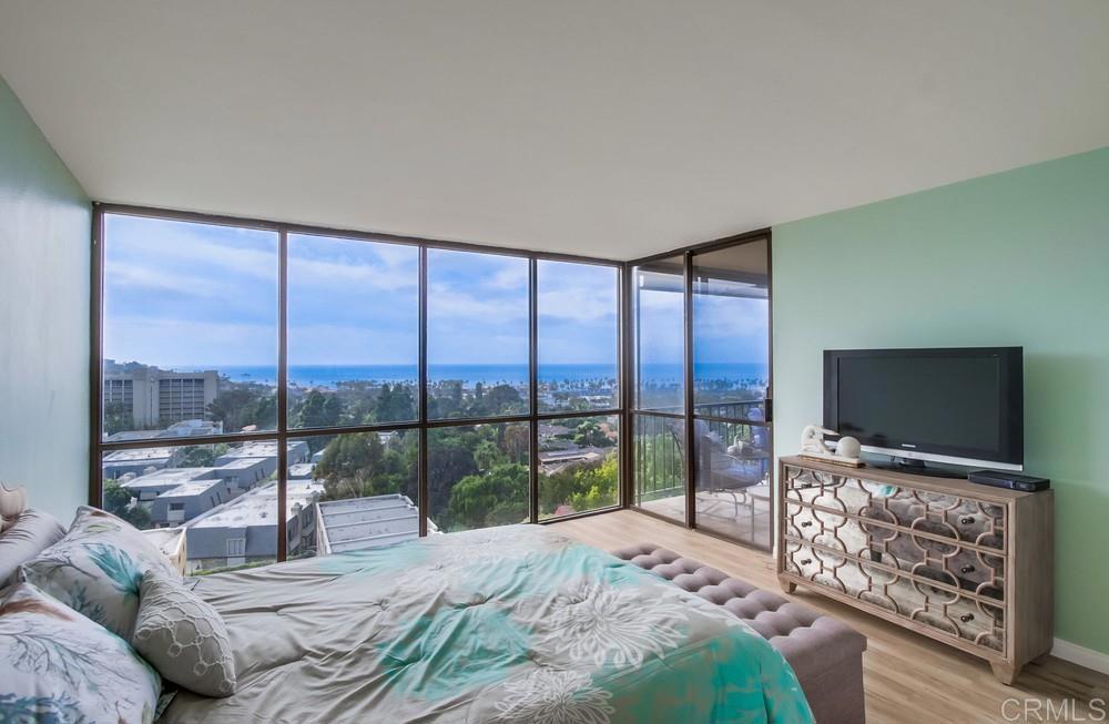 2500 Torrey Pines Road, Unit 802 La Jolla, CA 92037 - Photo 16 of 40 a bedroom with a bed and a flat screen tv