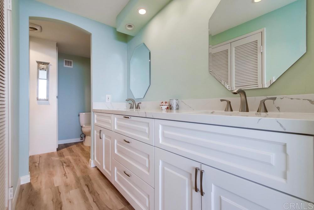2500 Torrey Pines Road, Unit 802 La Jolla, CA 92037 - Photo 21 of 40 a bathroom with a double vanity sink and a mirror