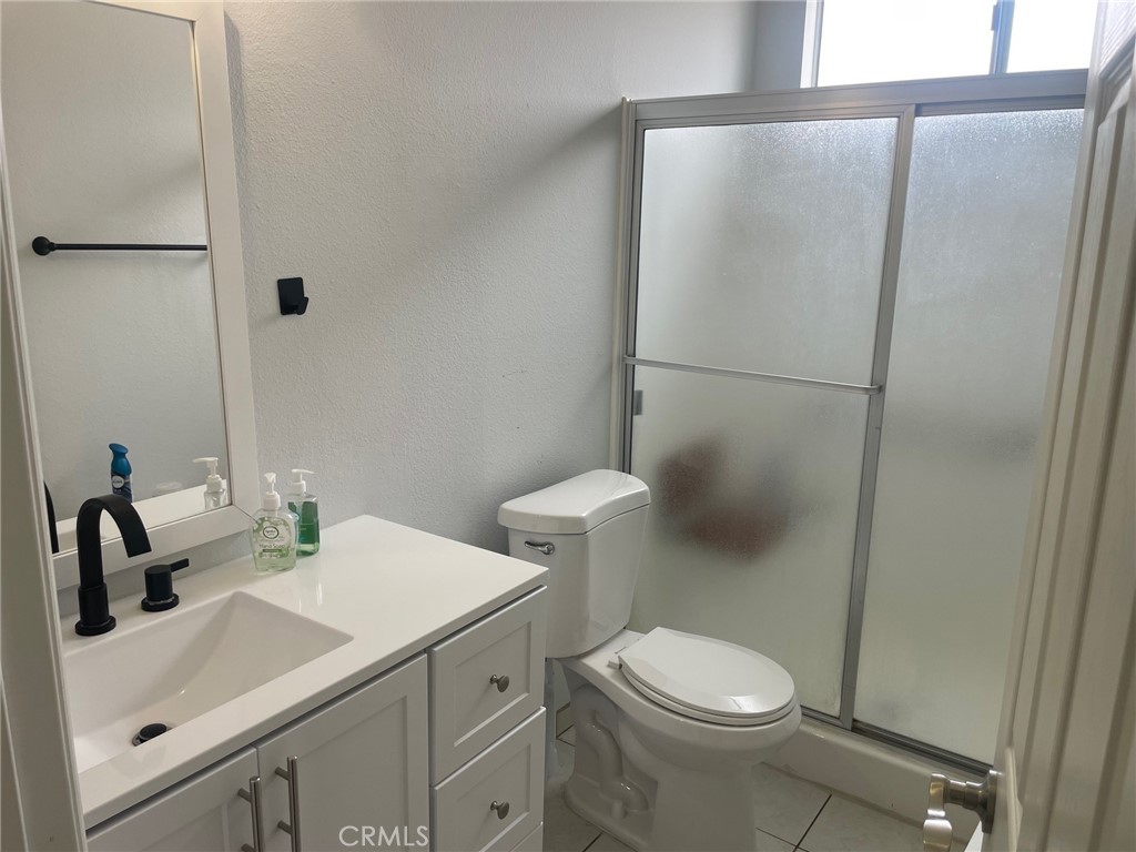 26592 Farrell Street Menifee, CA 92586 - Photo 21 of 31 a bathroom with a sink and a toilet