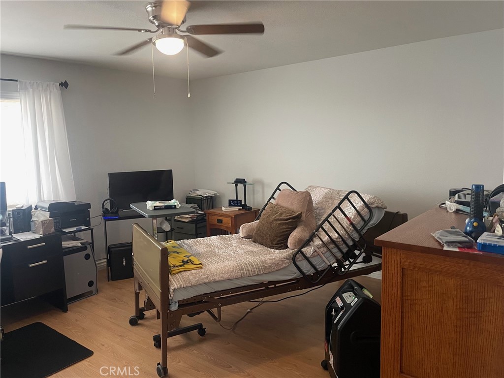 26592 Farrell Street Menifee, CA 92586 - Photo 23 of 31 a bedroom with a bed and a computer on the desk
