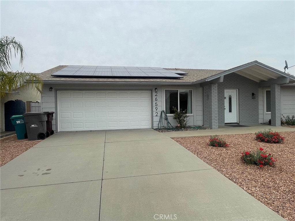 26592 Farrell Street Menifee, CA 92586 - Photo 4 of 31 a front view of a house with garage