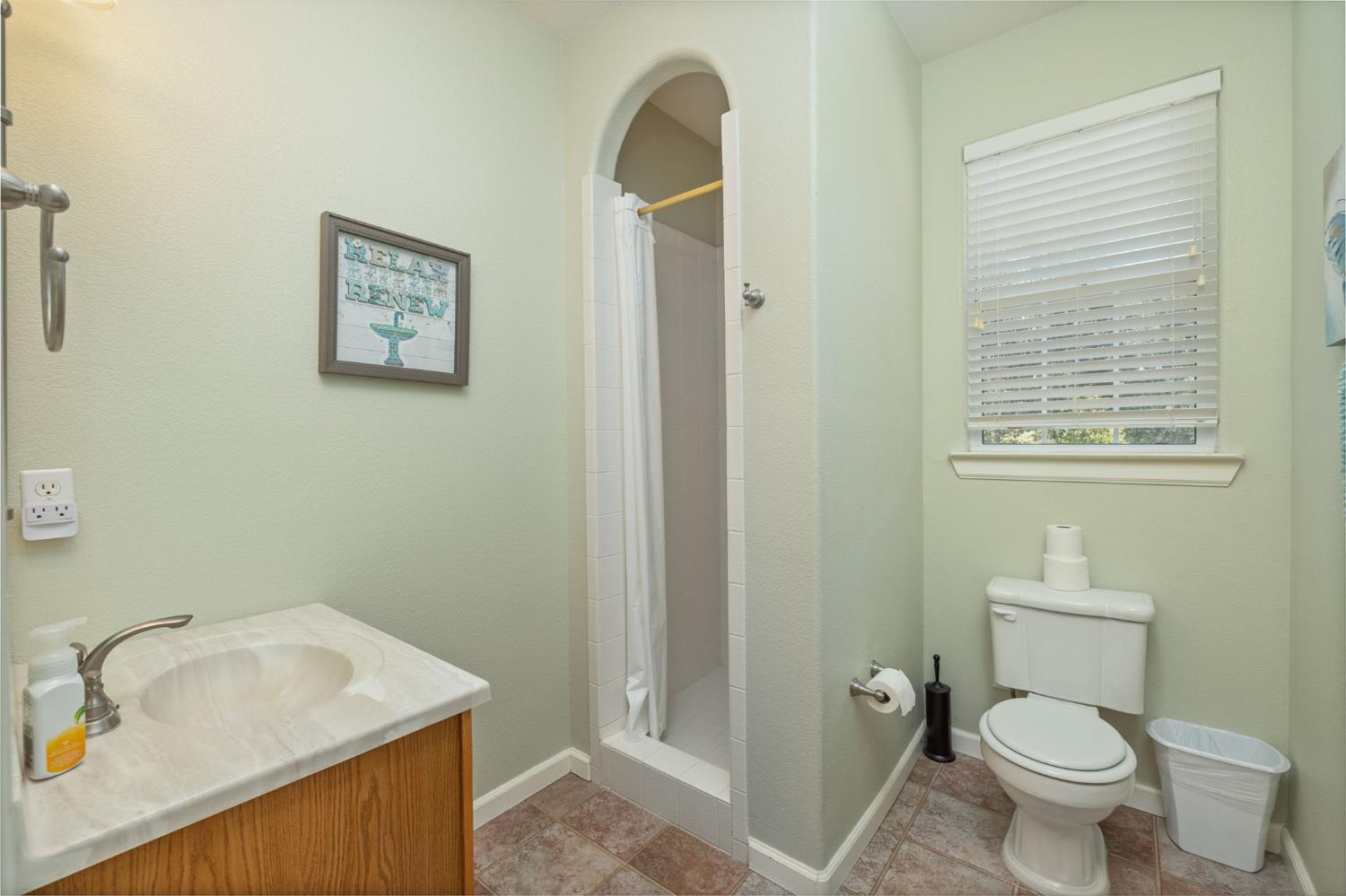 34811 Wintergreen Loop North Fork, CA 93643 - Photo 15 of 76 a bathroom with a sink toilet and vanity
