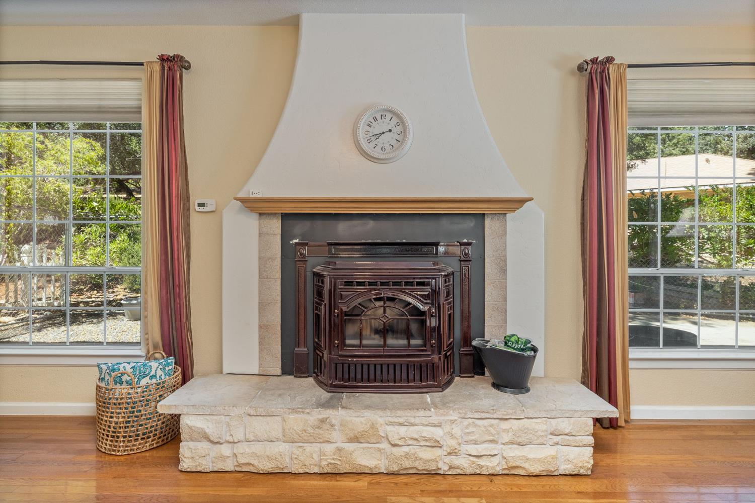 34811 Wintergreen Loop North Fork, CA 93643 - Photo 18 of 76 a living room with a fireplace and a window