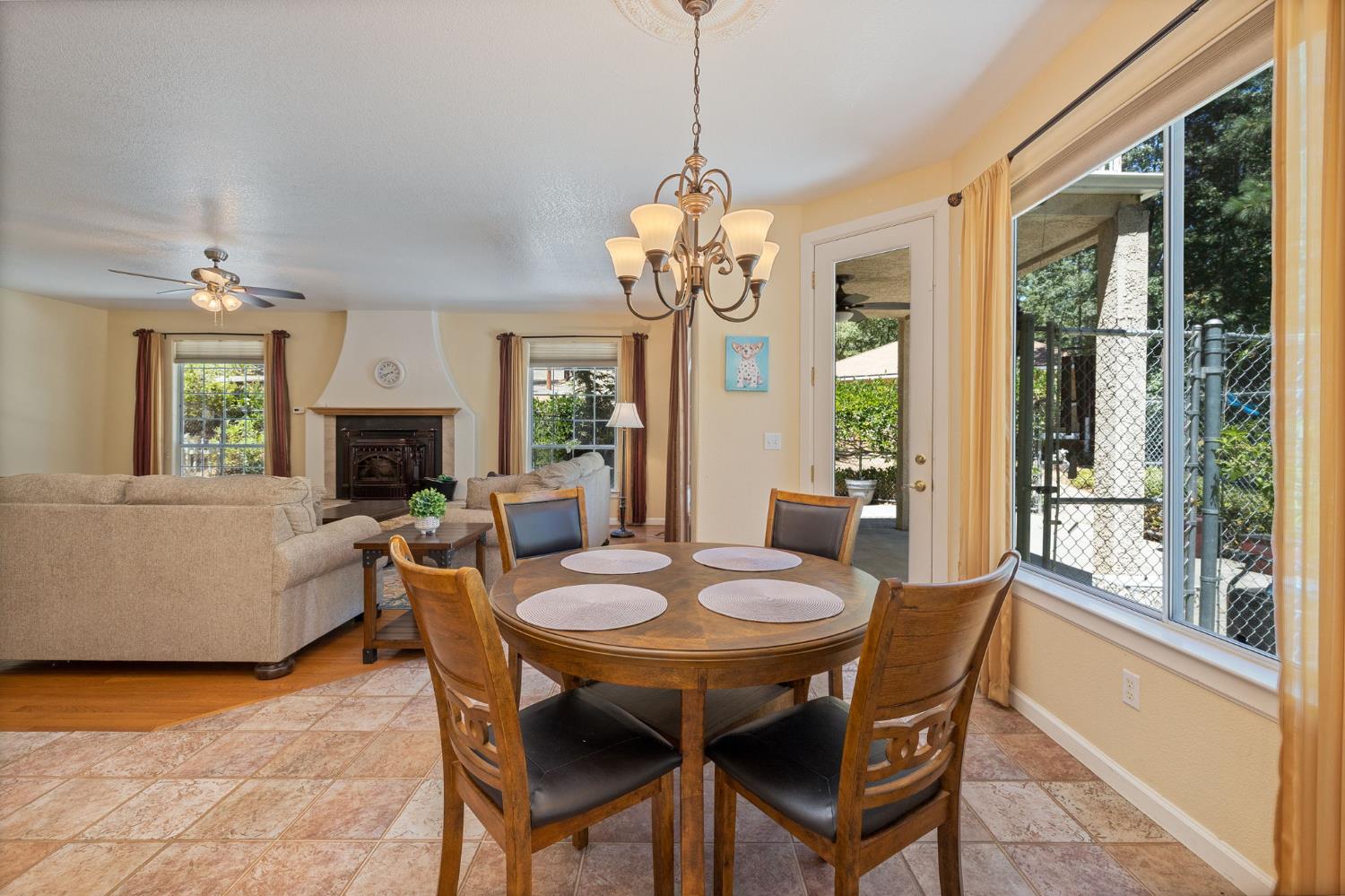 34811 Wintergreen Loop North Fork, CA 93643 - Photo 25 of 76 a dining room with wooden floor a chandelier a wooden table and chairs