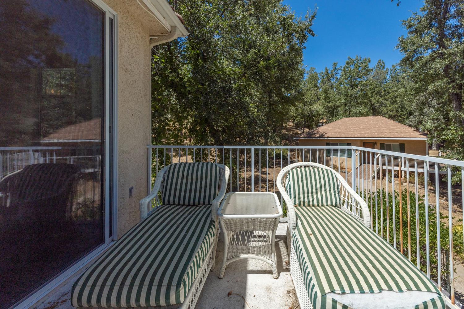 34811 Wintergreen Loop North Fork, CA 93643 - Photo 3 of 76 a view of balcony with wooden floor and fence