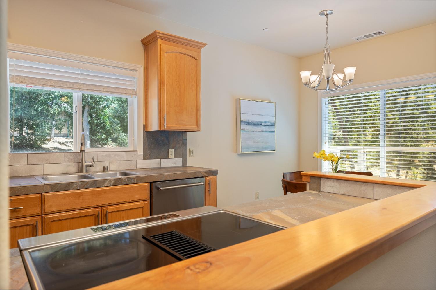 34811 Wintergreen Loop North Fork, CA 93643 - Photo 46 of 76 a kitchen with stainless steel appliances granite countertop a sink a stove and a granite counter top