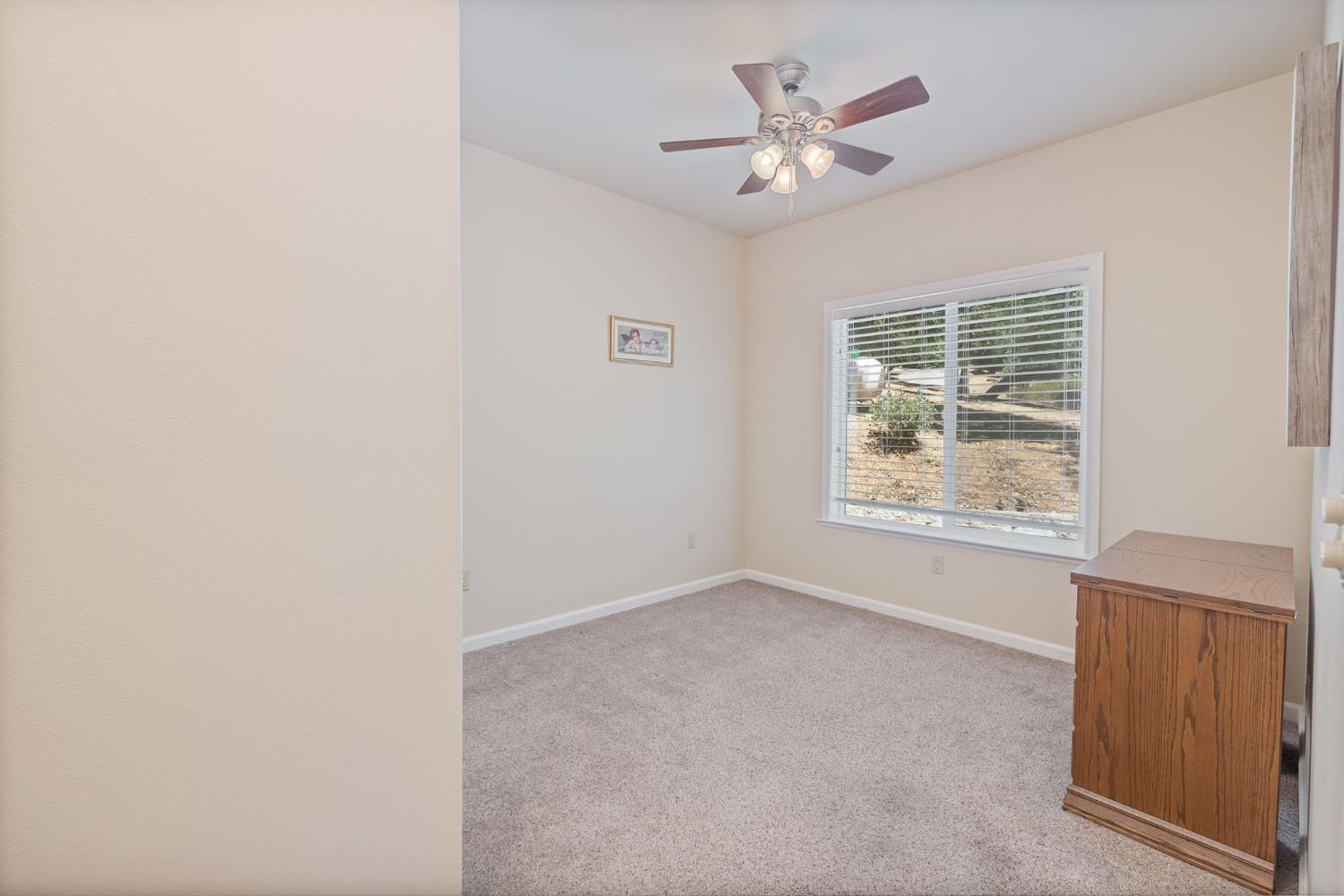 34811 Wintergreen Loop North Fork, CA 93643 - Photo 53 of 76 an empty room with windows and fan