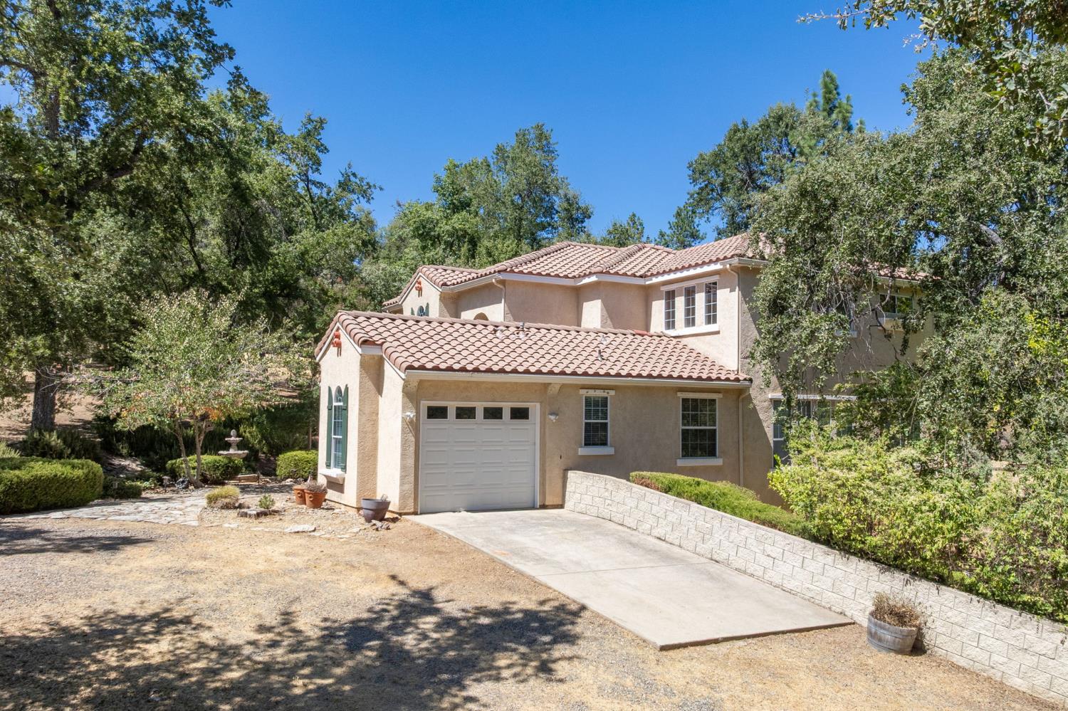 34811 Wintergreen Loop North Fork, CA 93643 - Photo 68 of 76 a front view of a house with a yard and garage