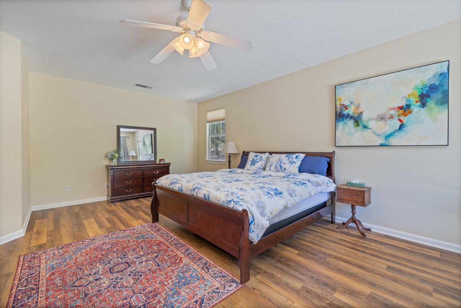 34811 Wintergreen Loop North Fork, CA 93643 - Photo 7 of 76 a bedroom with a bed a rug and wooden floor