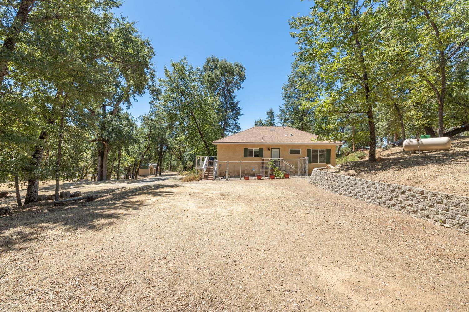 34811 Wintergreen Loop North Fork, CA 93643 - Photo 71 of 76 a front view of a house with a yard