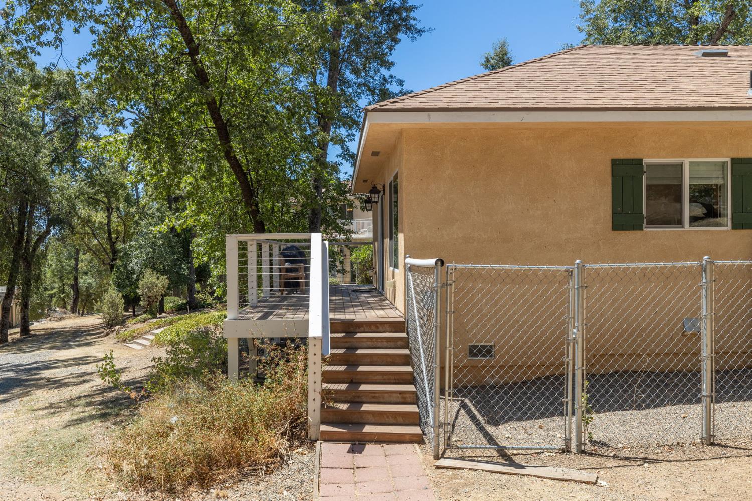 34811 Wintergreen Loop North Fork, CA 93643 - Photo 74 of 76 a front view of a house with wooden fence