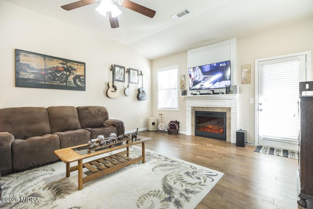 135 Abelia Lane Byron, GA 31008 - Photo 14 of 32 a living room with furniture and a fireplace